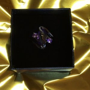 3  carats genuine Purple crystal set in titanium.